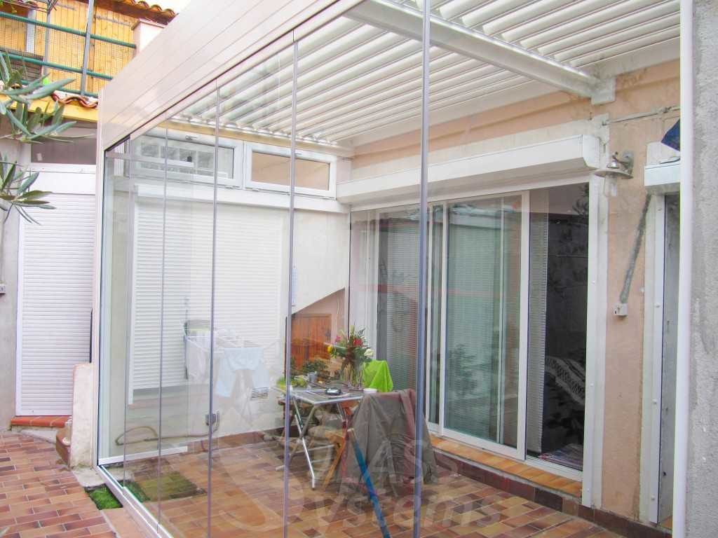 fermeture en verre pergola bioclimatique