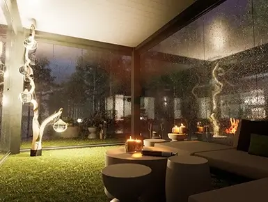 Vue de l'intérieur d'une pergola bioclimatique sur mesure de nuit